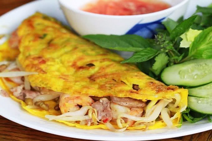 Bánh xèo tôm thịt với nước chấm nước mắm truyền thống Phan Thiết: Hương vị miền đất Tây Nguyên 1 Banh Xeo Tom Thit Voi Nuoc Cham Nuoc Mam Truyen Thong Phan Thiet